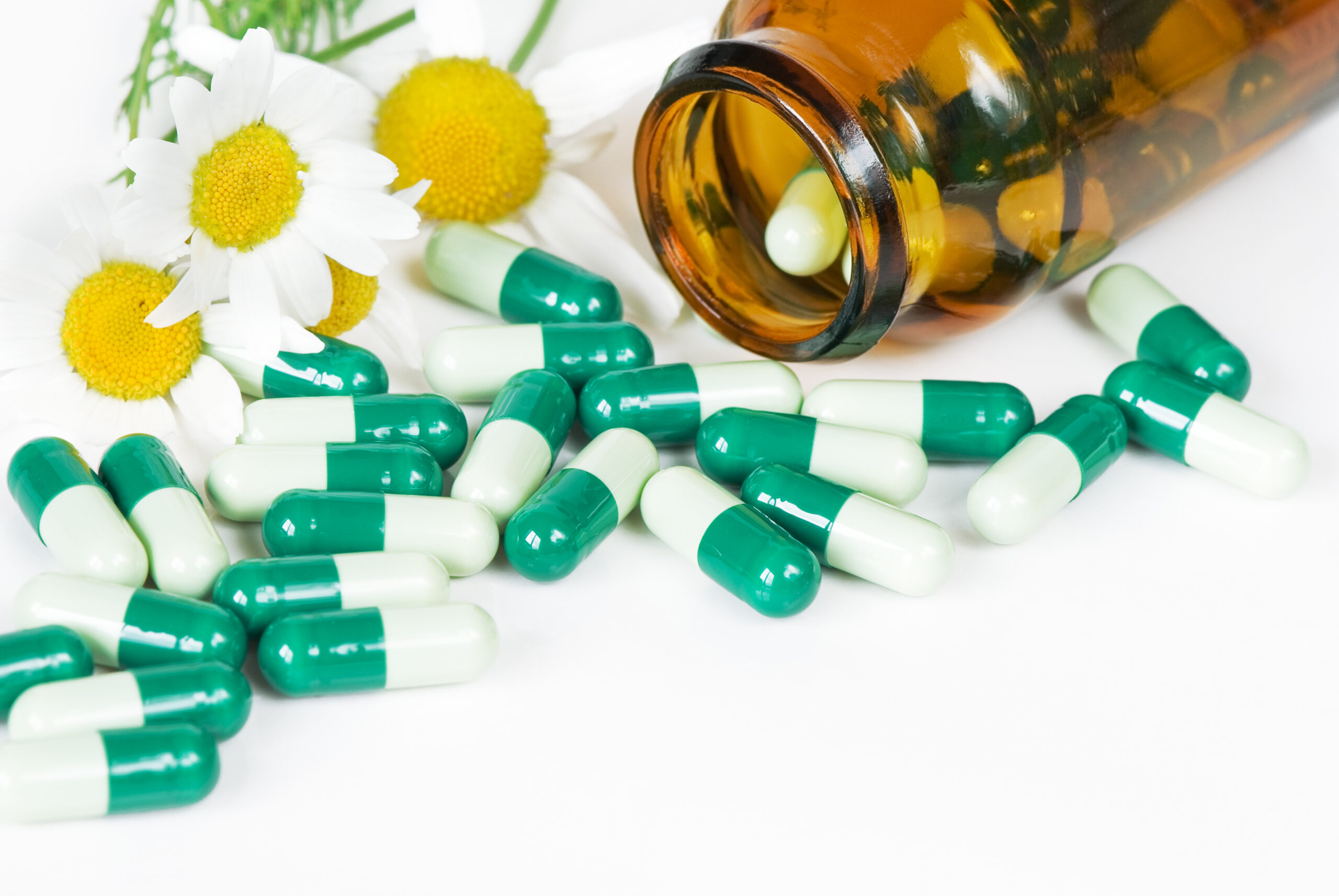 Photodune 18363736 Spilled Pills A Bottle And Two Flowers Of Chamomile L 2 Scaled