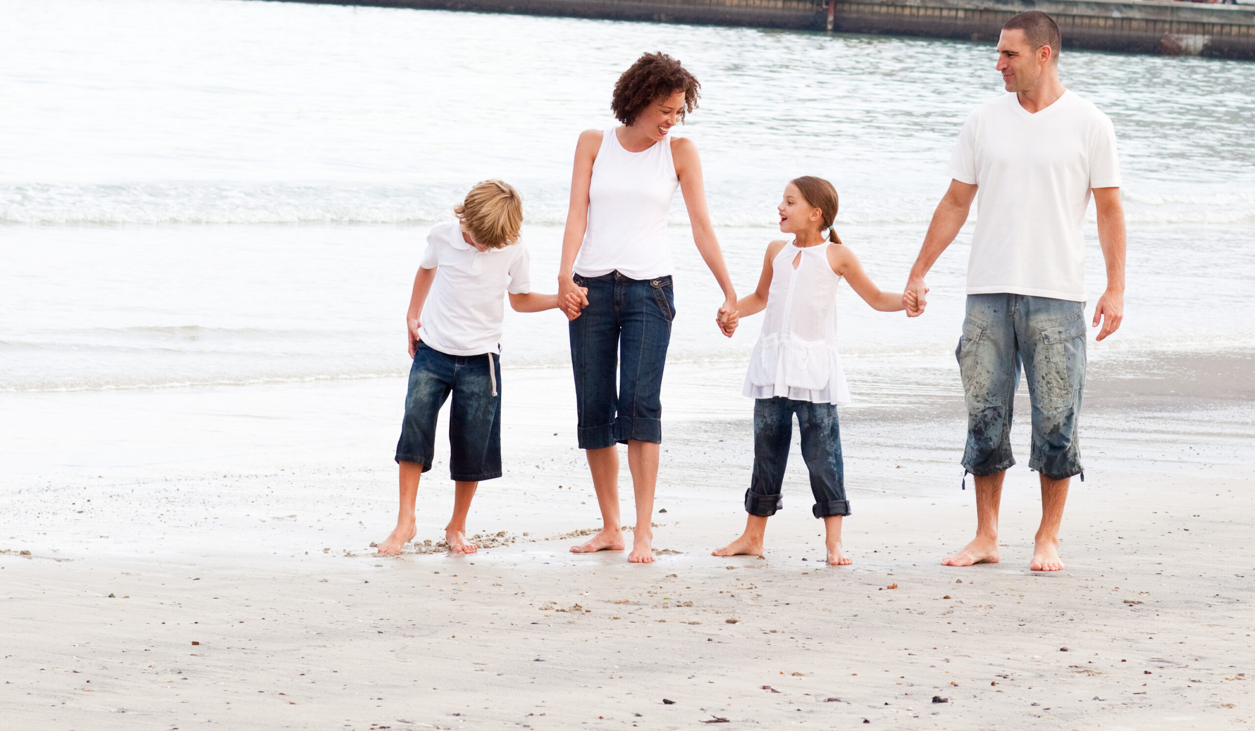 Photodune 8225256 Family Walking On A Beach M Scaled